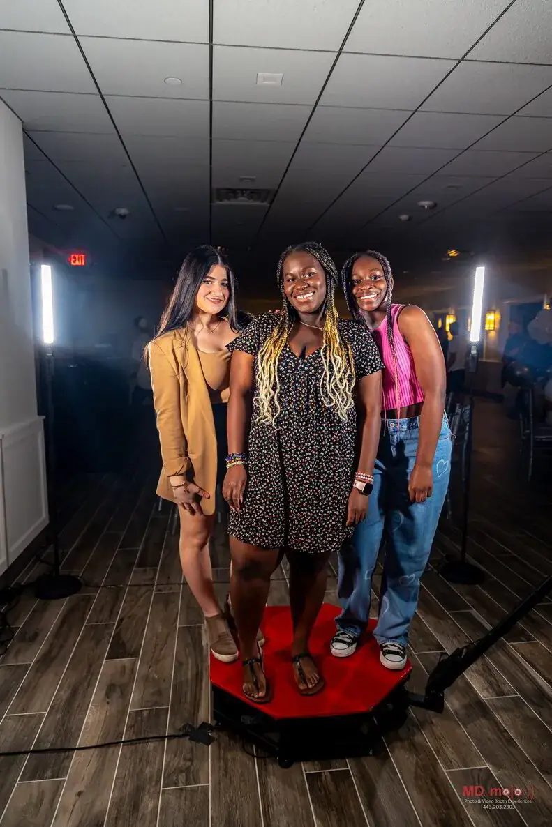 Guests on the 360 photo booth platform