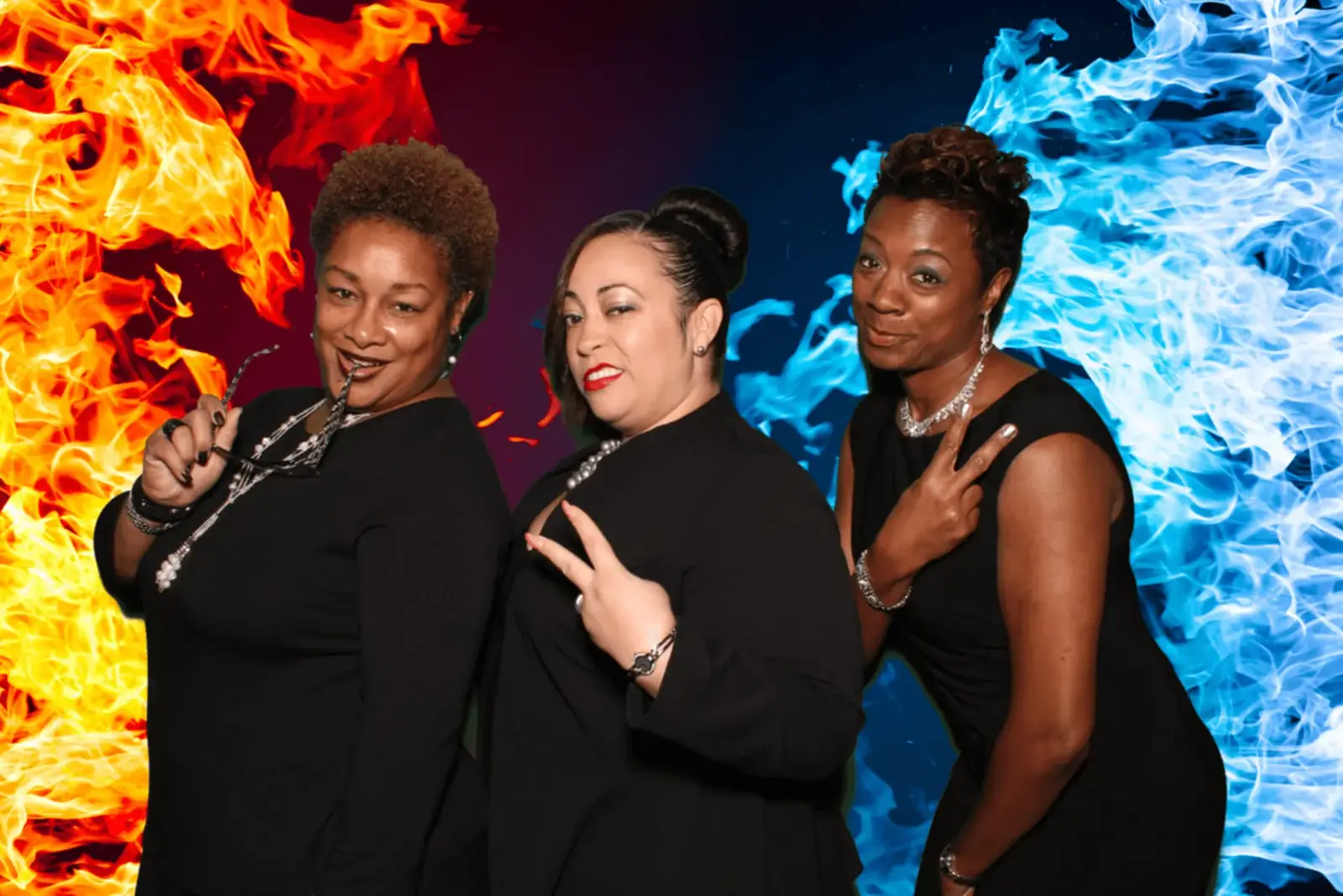 Guests posing in front of a fire and ice photo booth backdrop
