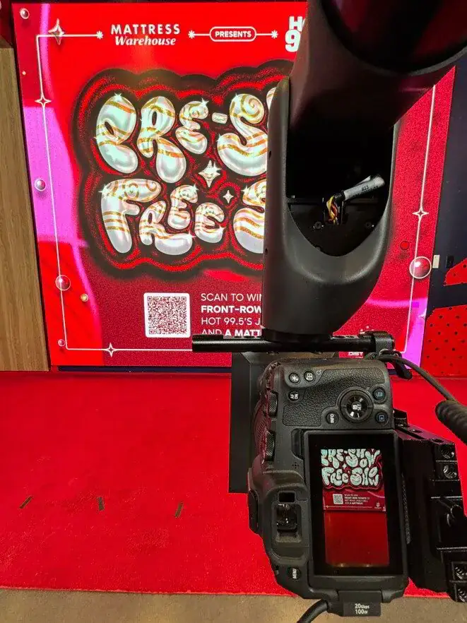 GlamBot camera and branded backdrop at a corporate activation