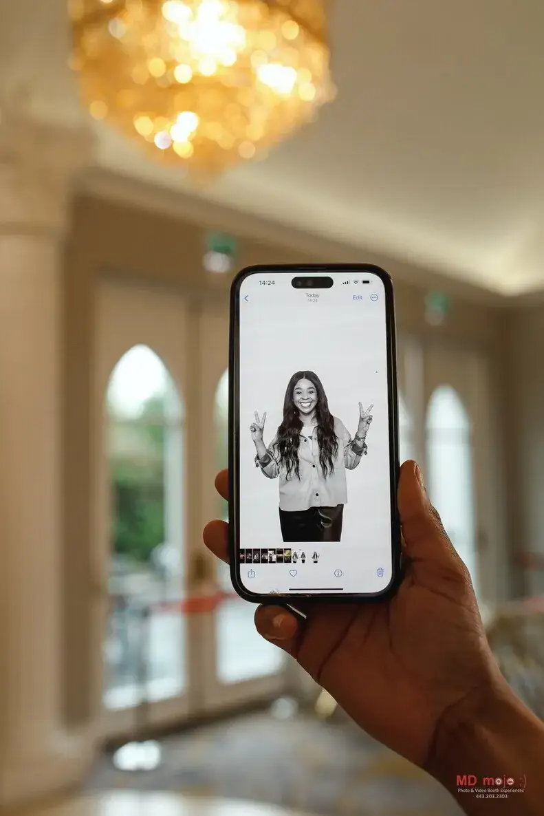Black and white glam photo booth print on a phone
