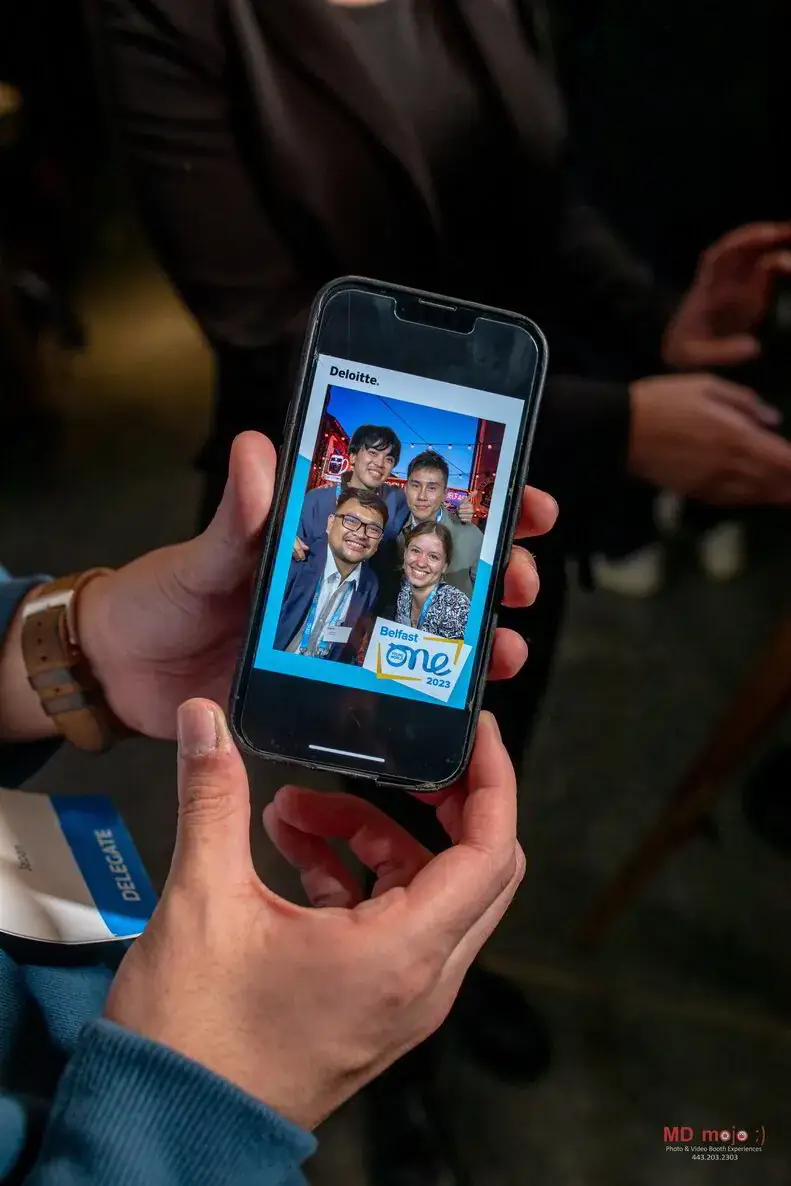 Guest scanning a QR code at the branded photo booth