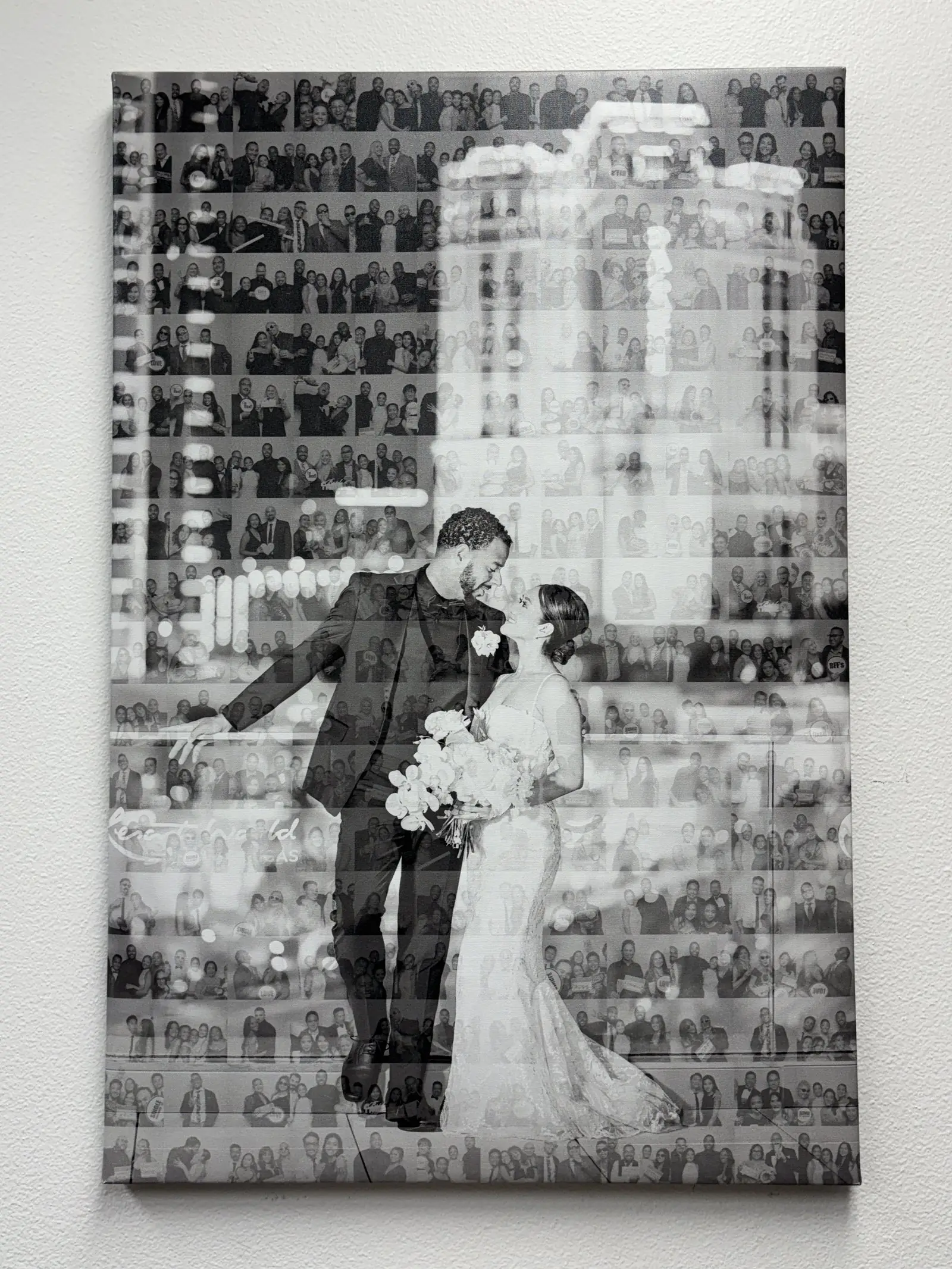 A finished black-and-white photo mosaic on canvas of a couple, assembled from hundreds of guest photos